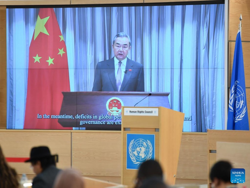 Chinese Foreign Minister Wang Yi, also a member of the Political Bureau of the Communist Party of China Central Committee, delivers a video address at the high-level meeting of the 58th session of the United Nations Human Rights Council, Feb. 24, 2025. (Xinhua/Lian Yi)