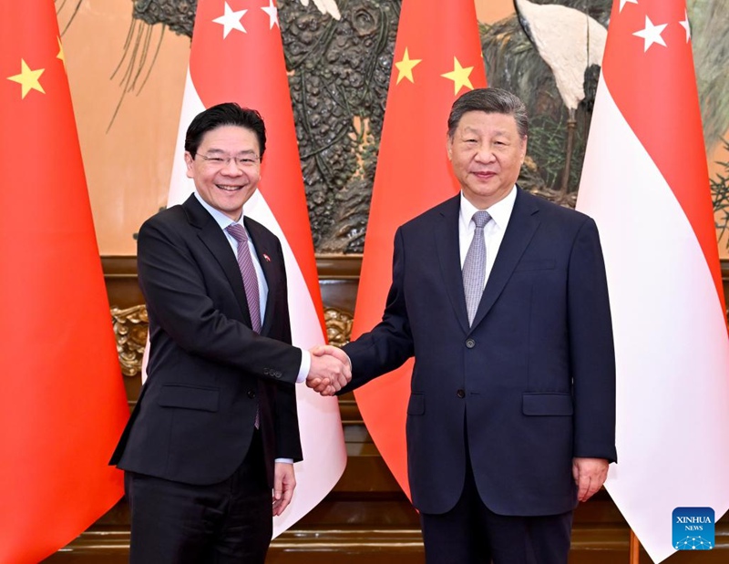 Rais Xi Jinping wa China akikutana na Waziri Mkuu wa Singapore Lawrence Wong, ambaye yuko katika ziara rasmi nchini China, kwenye Jumba la Mikutano ya Umma   la Beijing, China, Juni 24, 2025. (Xinhua/Yue Yuewei)